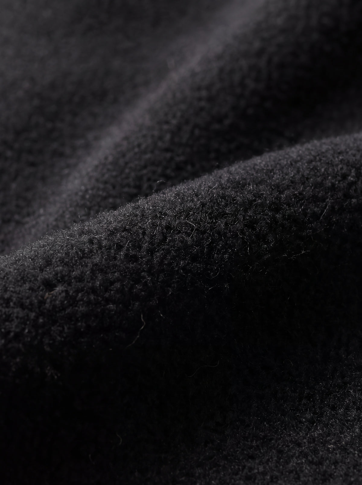 Close-up da textura interna fleece da Calça 2 em 1 Cordilheira Pathfinder Masculina, Roupa da Marca Cordilheira com Boa qualidade, resistência e conforto Confiável para frio, neve e esporte outdoor.